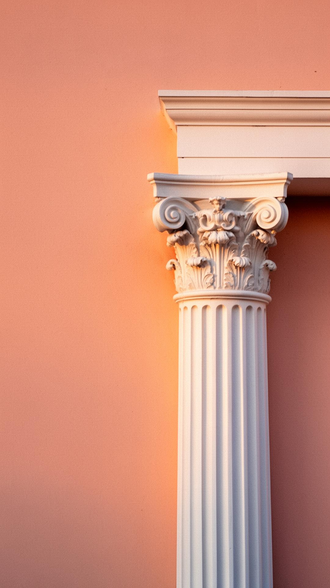 A classical column capital against soft salmon plaster